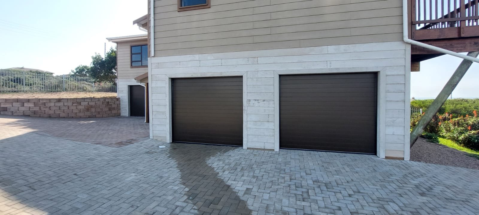 Finished dark double garage doors